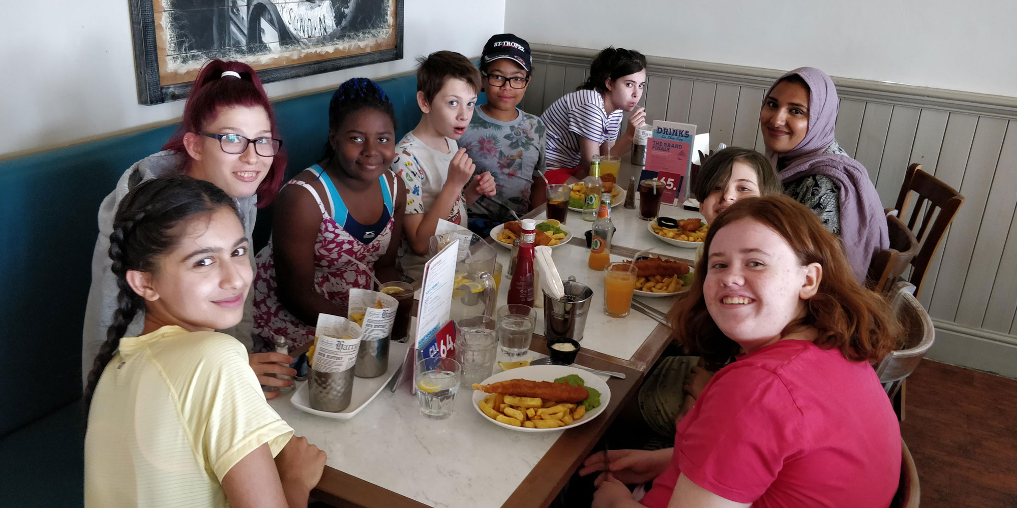 Young carers enjoying Fish and Chips at the seaside